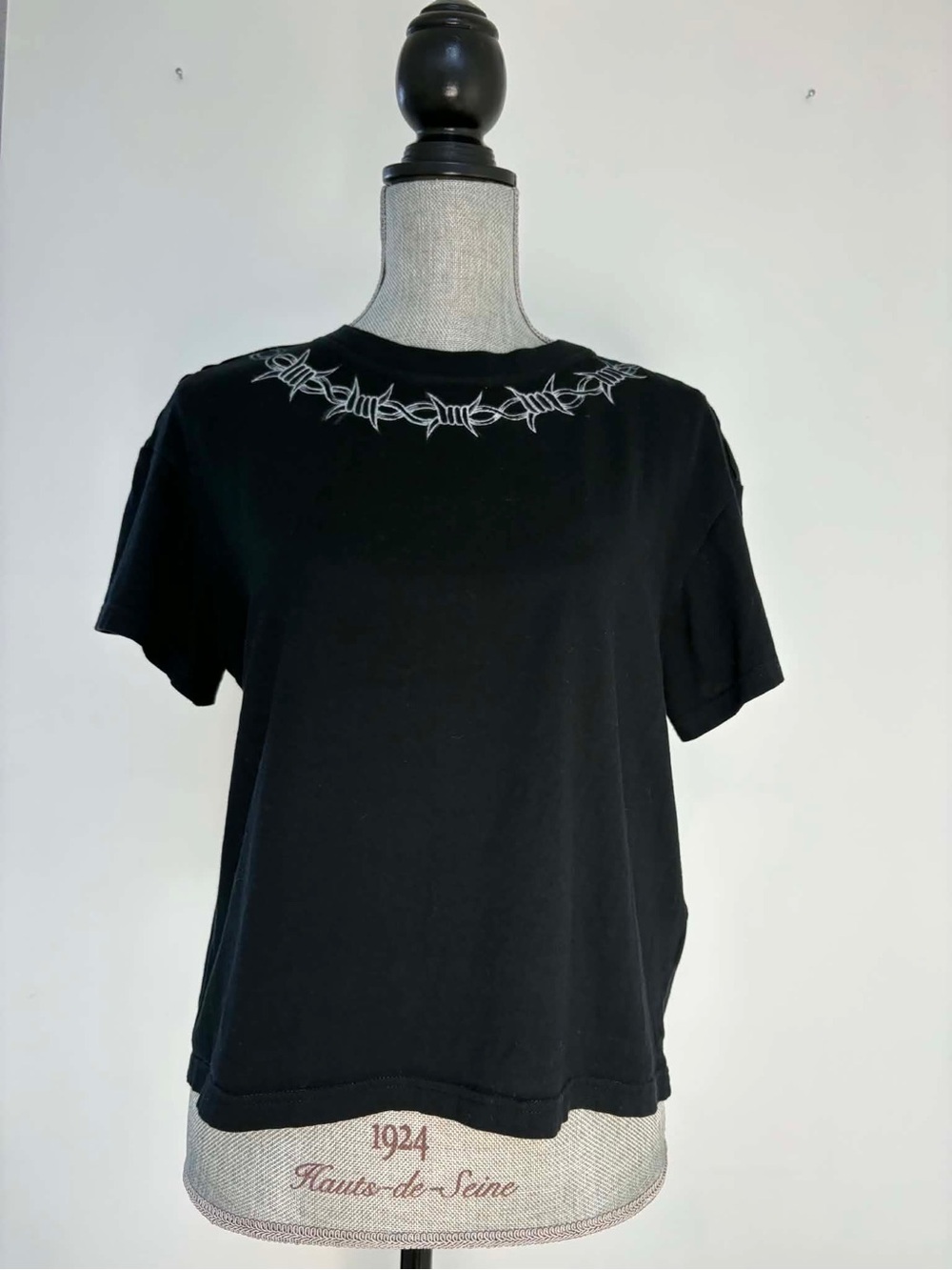 Black Short-Sleeve Women's Tee with Neckline Barbed Wire Detail